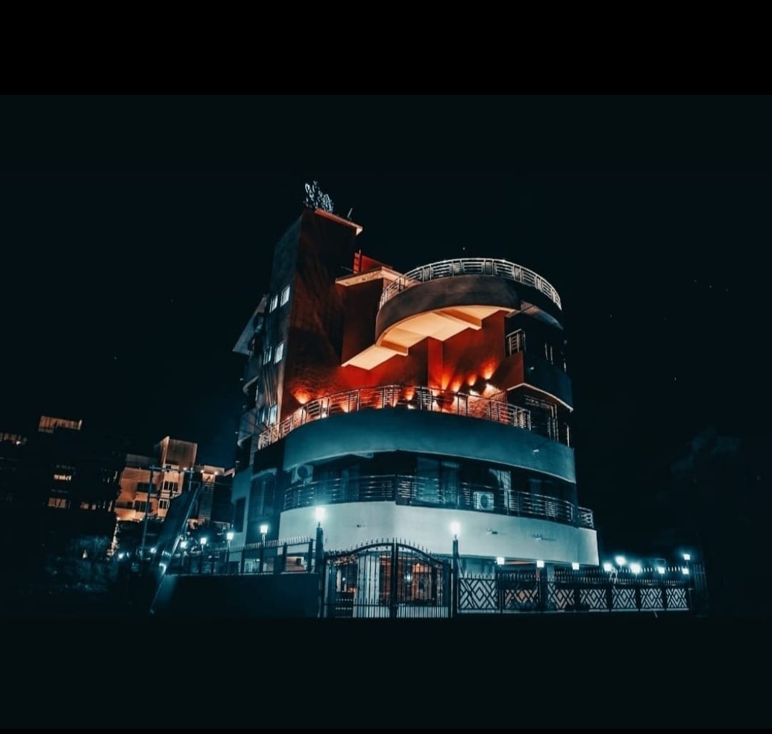 Pooja Villa Suites illuminated exterior at night, Igatpuri
